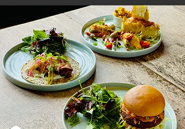 Boho Baja dishes and burger served at The Pelham Arms