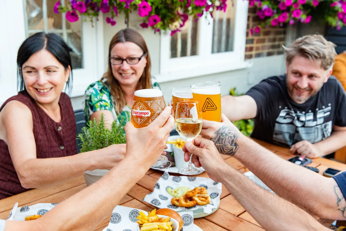 Friends raising a glass at The Pelham Arms